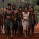 Viola Davis as General Nanisca leads a group of rescued Agojie members in The Woman King.